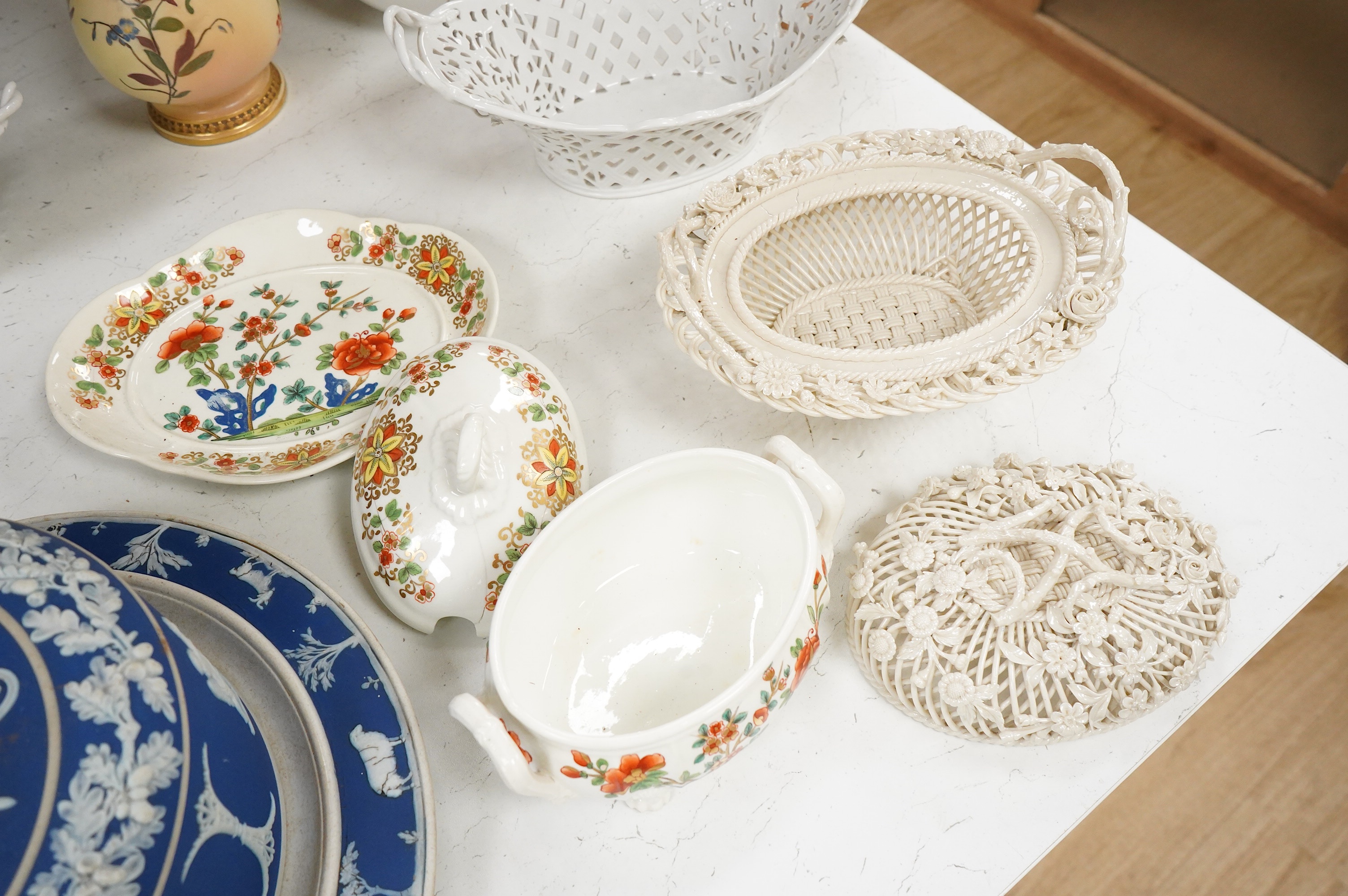 A 19th century Derby tureen and cover, a pair of Royal Worcester blush vase-26cm high, a Belleek basket and cover, a Wedgwood blue Jasperware cheese dish and associated cover, two continental baskets and vase. (7).